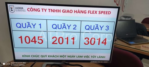 Queue management display screen showing ticket numbers and service counters in customer service system