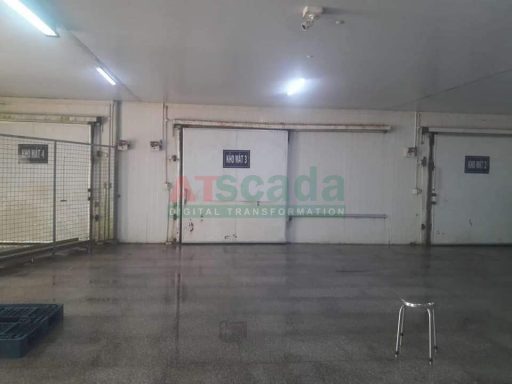 Cold storage warehouse interior with insulated doors and temperature controlled environment for industrial storage system