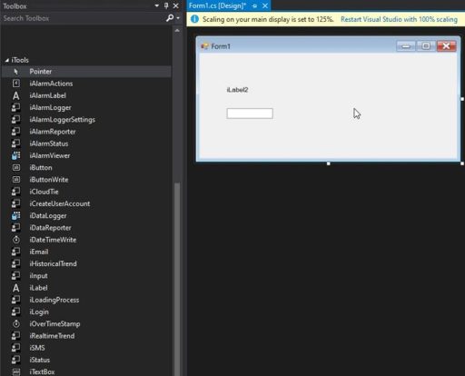 Visual Studio Windows Forms designer with iTools toolbox components on the left and Form1 displaying iLabel and textbox controls.